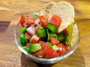 Pico De Gallo is a fresh mexican salsa. Spicy, fruity, and so easy to make, this recipe goes great with tortilla chips, quesadillas, or nachos. You can even put it on your tacos! | Tiny Kitchen Cuisine | https://tiny.kitchen