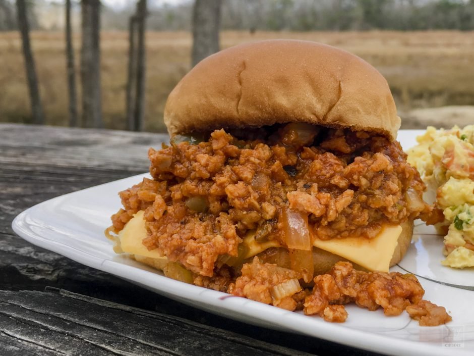 My recipe for vegetarian sloppy joes uses TVP (textured vegetable protein) mixed with a thick and tangy tomato sauce to make this spin on a classic sandwich. Delicious and healthy! It's so flavorful that even avid meat-eaters won't notice there's no meat! | Tiny Kitchen Cuisine | https://tiny.kitchen/